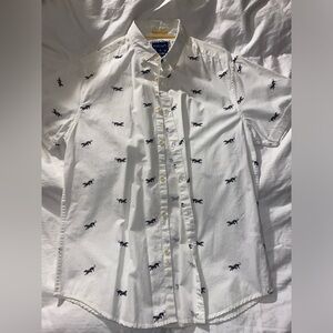 White Polo with cheetahs all over. Size M